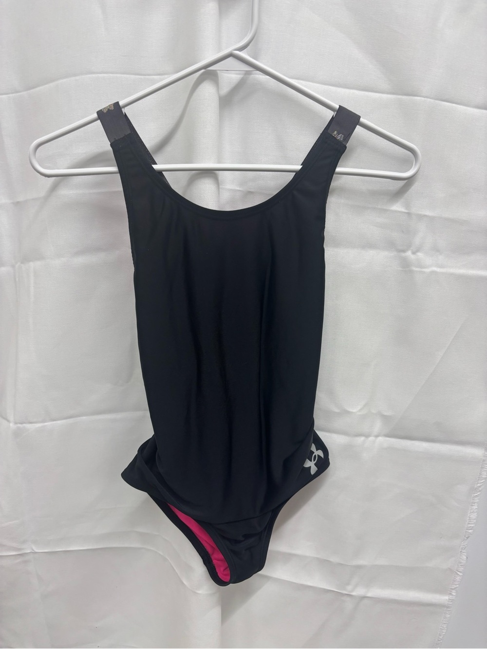 Under Armor Black One-Piece Swimsuit with Pink Lining.